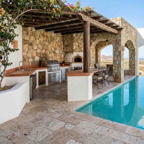 outdoor kitchen with built in grill and modern appliance setup